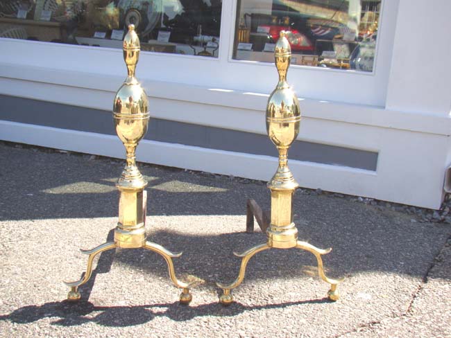 A fine pair of Antique Andirons from New York in the 'Lemon-on-lemon' style circa 1800-1810